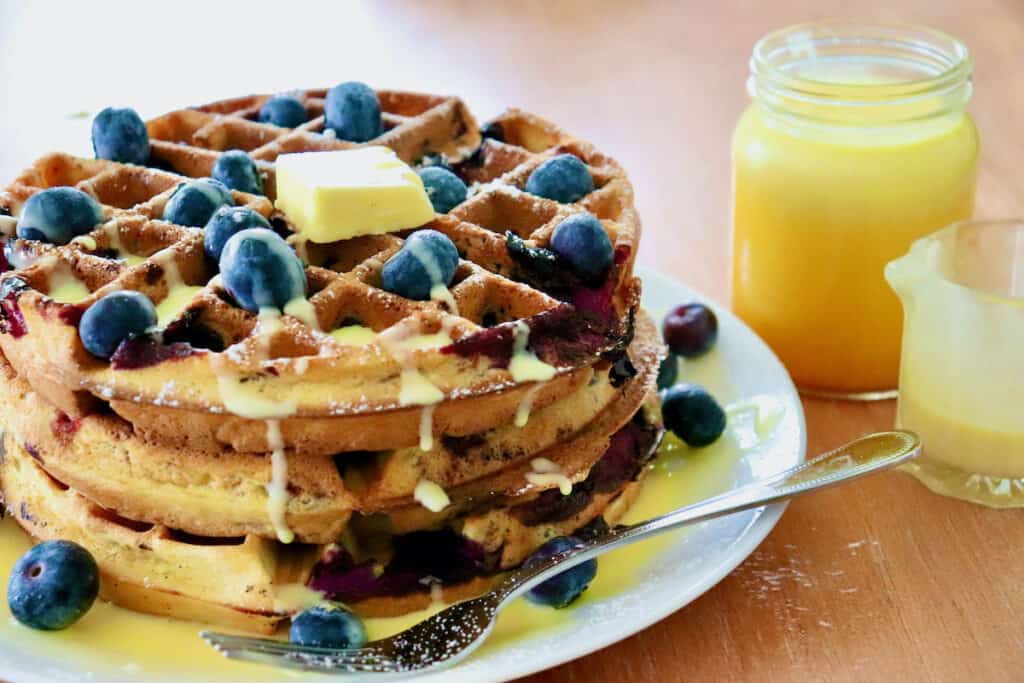 Stack of blueberry waffles with Meyer Lemon Curd Créme Anglaise