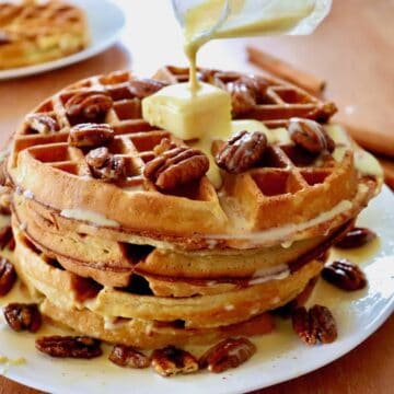 Stack of pecan waffles with créme anglaise