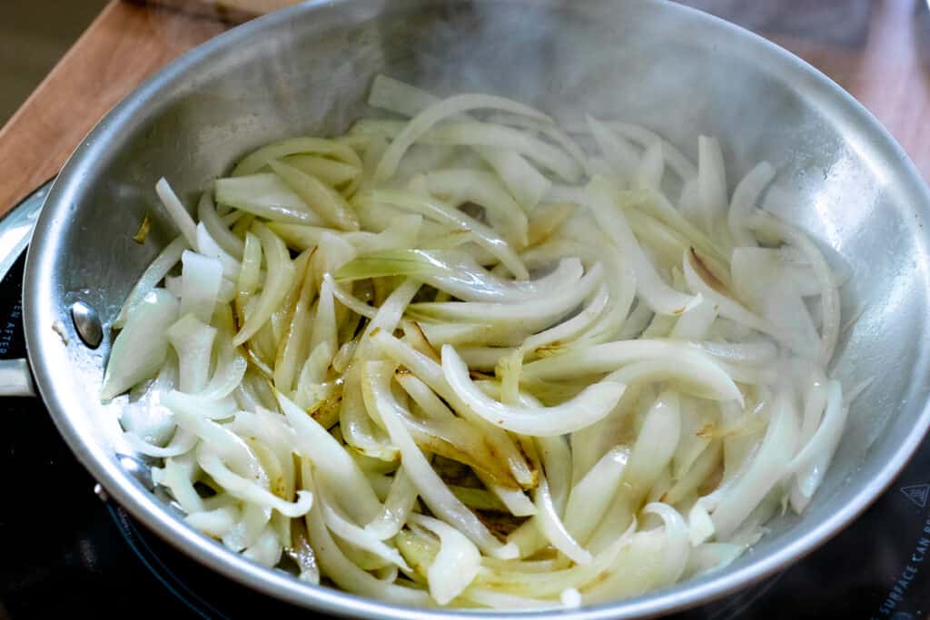 Sliced onions in high heat skillet
